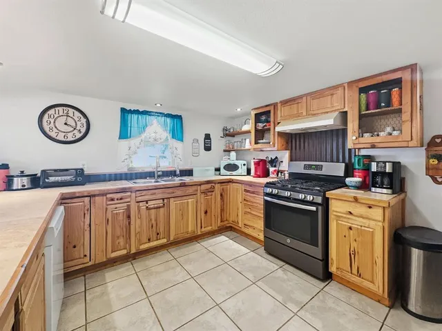 a view of kitchen with furniture and wooden floor