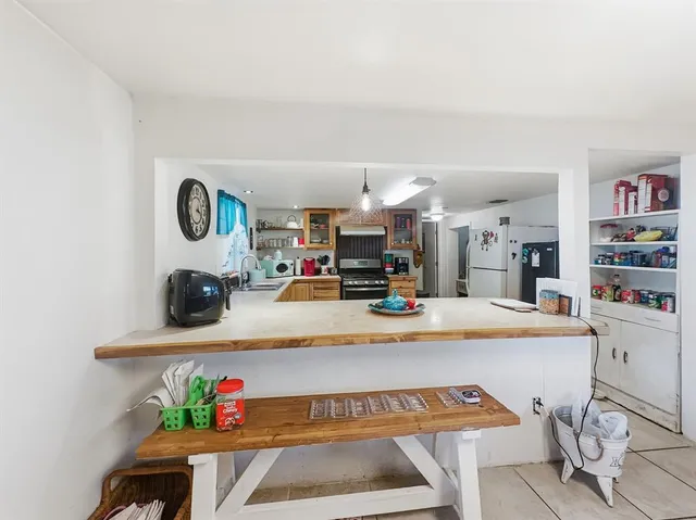 a view of a tree in front of a house