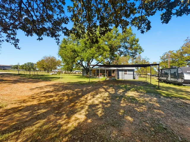 a view of a swimming pool with an outdoor space and seating area
