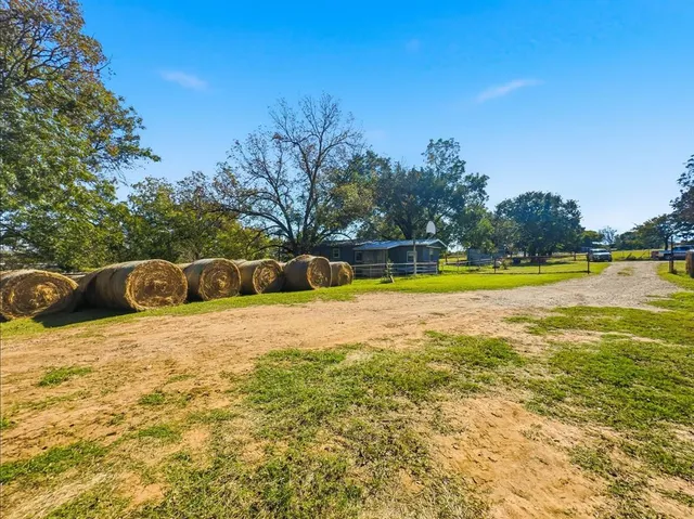 a view of a yard with an outdoor space