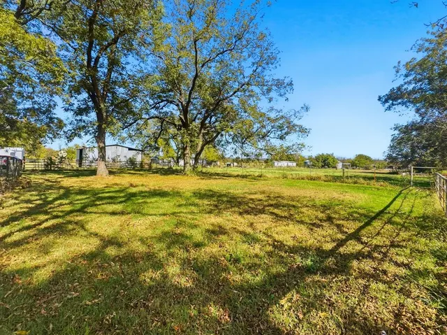 a view of a house with a big yard