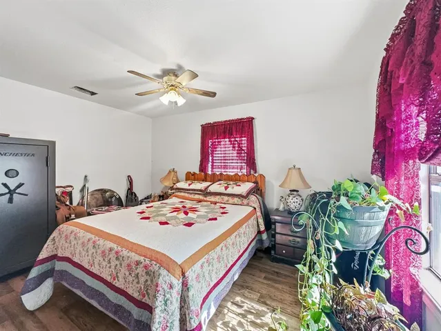 a bed room with a bed and furniture