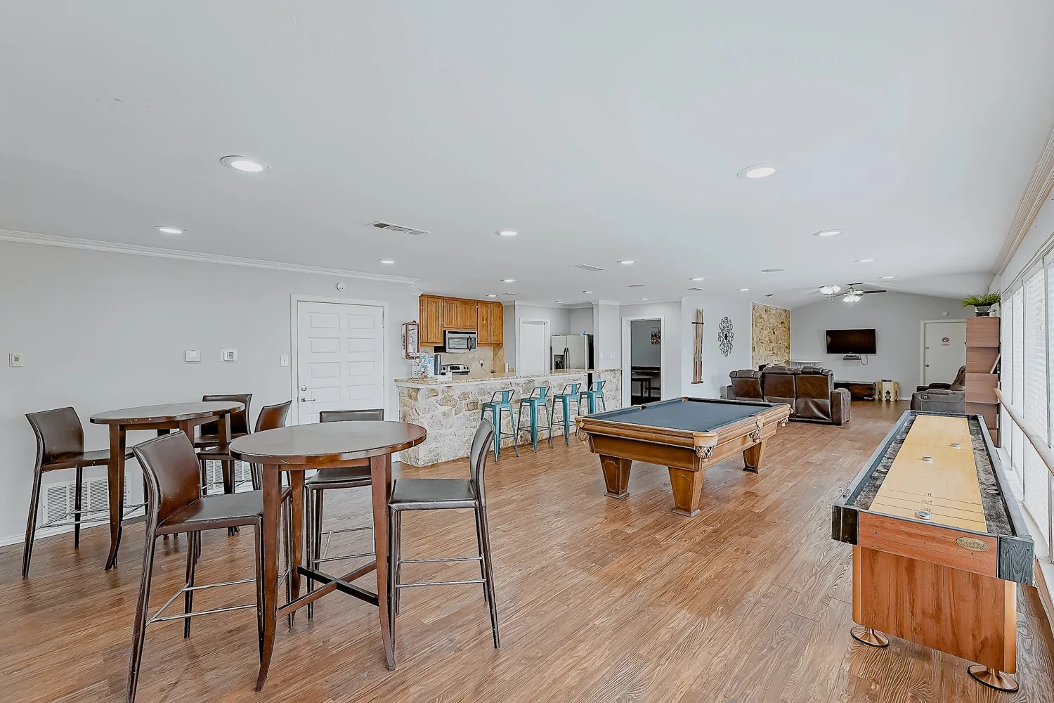 8100 North Mopac Expressway, Unit 9145 Austin, TX 78759 - Photo 6 of 28 a living room with furniture a wooden floor and a table