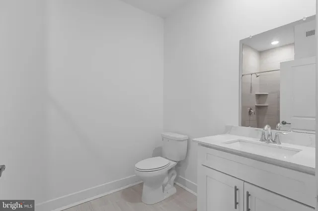 a view of entryway with stairs and wooden floor