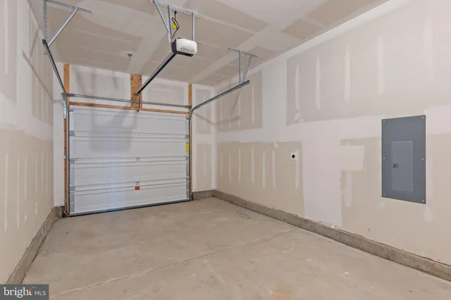 a front view of a house with a garage