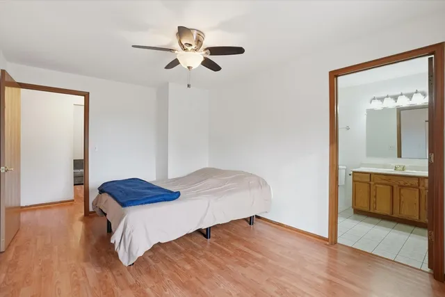 a bedroom with a bed and a dresser