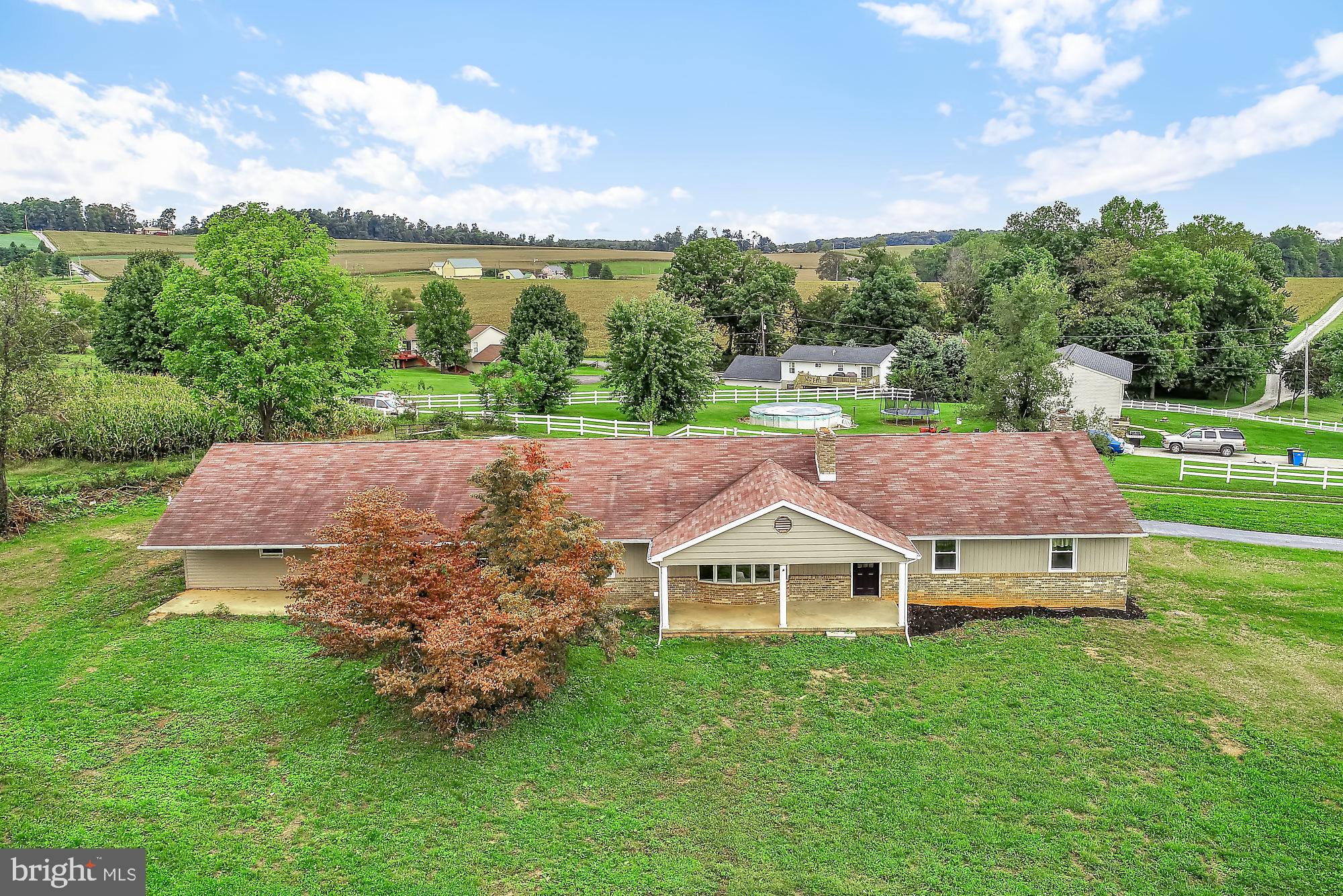 a view of a house with a big yard