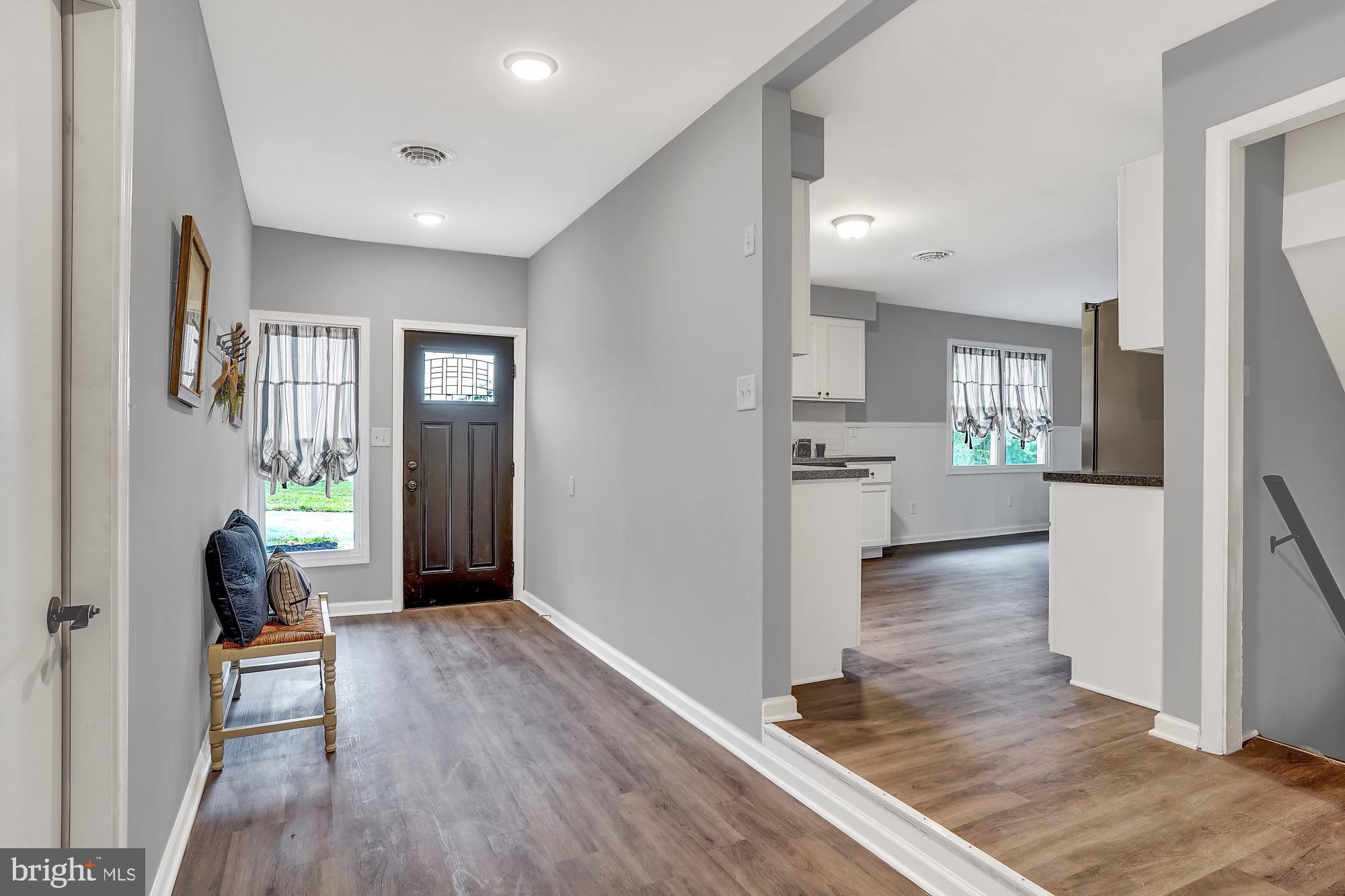 13296 Fishel Road Felton, PA 17322 - Photo 14 of 51 a view of a hallway view with wooden floor and a living room