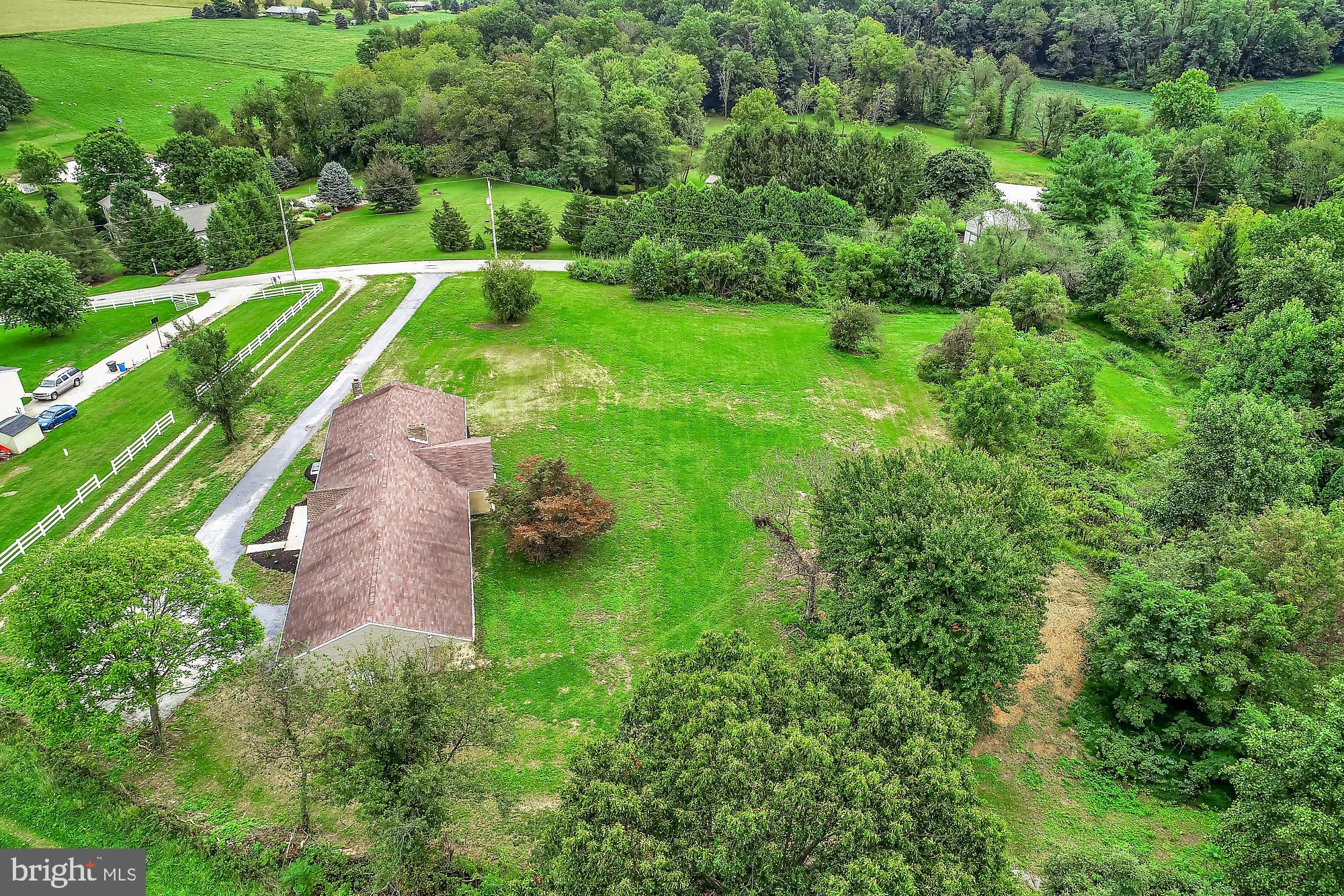 13296 Fishel Road Felton, PA 17322 - Photo 34 of 51 a view of a yard with plants and large trees