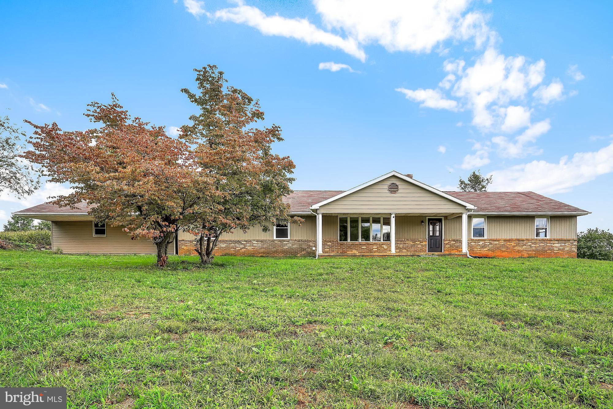 13296 Fishel Road Felton, PA 17322 - Photo 48 of 51 a white house with a big yard and large trees