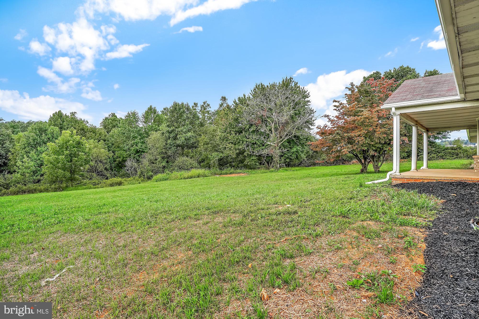13296 Fishel Road Felton, PA 17322 - Photo 50 of 51 a view of a garden with a house in the background