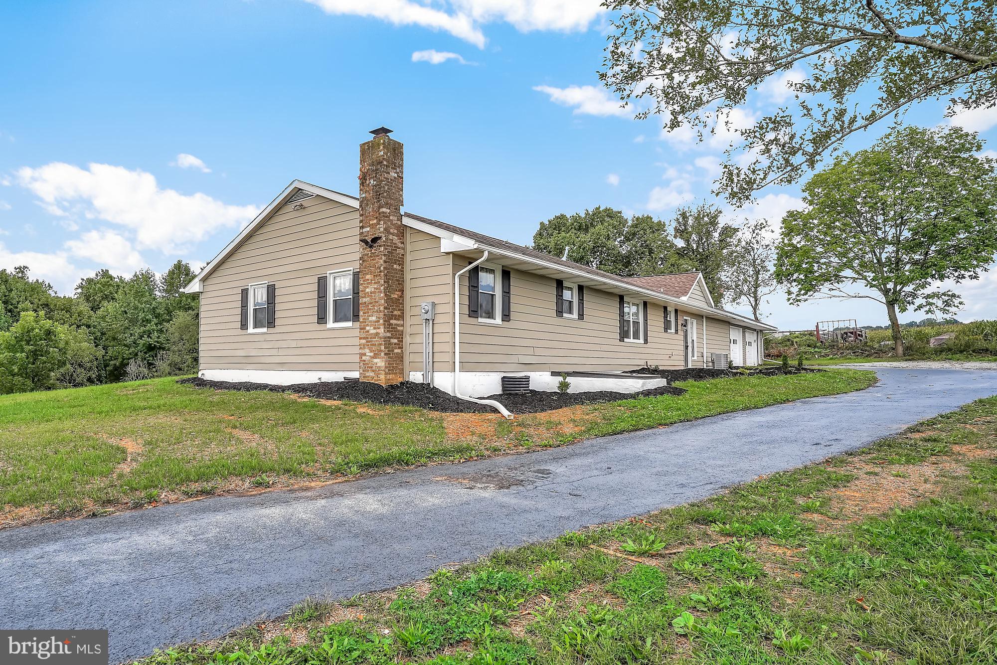 13296 Fishel Road Felton, PA 17322 - Photo 51 of 51 a view of a house with yard and a garden