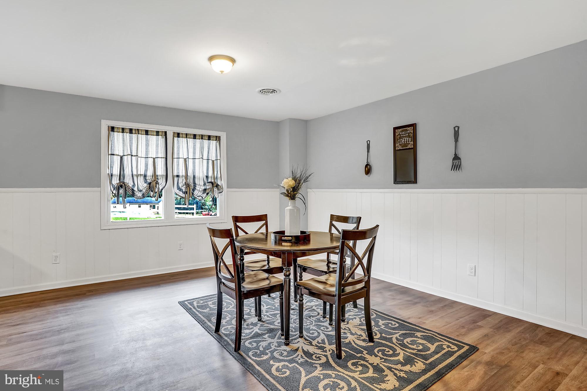 13296 Fishel Road Felton, PA 17322 - Photo 7 of 51 a view of a dining room with furniture and wooden floor