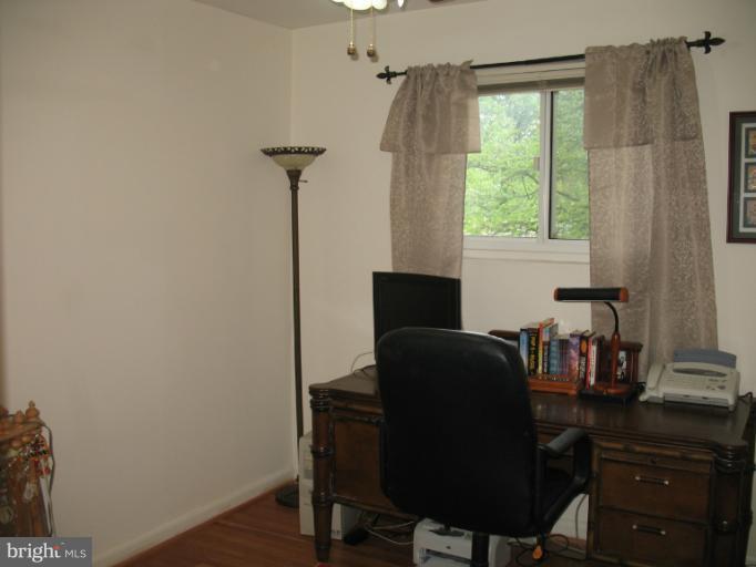 806 Malta Lane Silver Spring, MD 20901 - Photo 19 of 30 a view of a workspace with furniture and a window