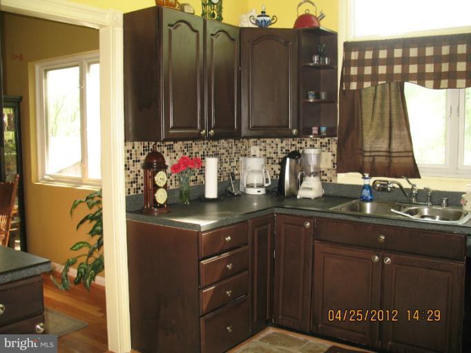 806 Malta Lane Silver Spring, MD 20901 - Photo 20 of 30 a kitchen with a sink and cabinets