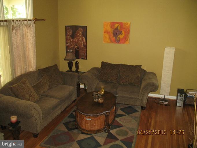806 Malta Lane Silver Spring, MD 20901 - Photo 3 of 30 a living room with furniture and a rug