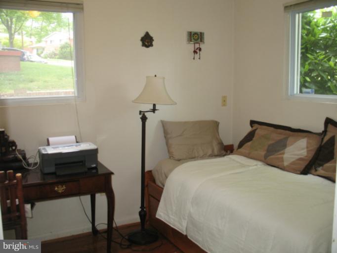806 Malta Lane Silver Spring, MD 20901 - Photo 7 of 30 a bedroom with two beds and a desk