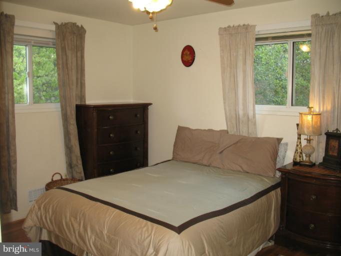 806 Malta Lane Silver Spring, MD 20901 - Photo 10 of 30 a bedroom with a bed and a window
