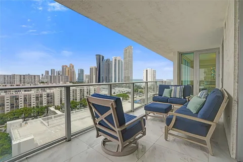 a roof deck with a table and chairs