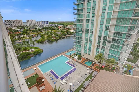 a view of a balcony with chairs and a table
