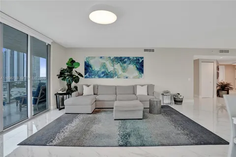 a living room with furniture and a rug