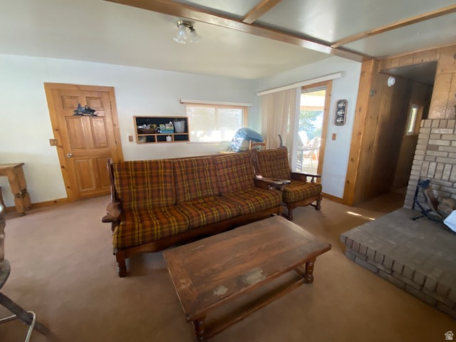 913 East 5300 North Helper, UT 84526 - Photo 16 of 29 Living room with light colored carpet and wood walls