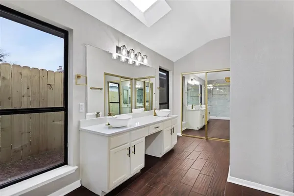 a bathroom with a sink and a mirror