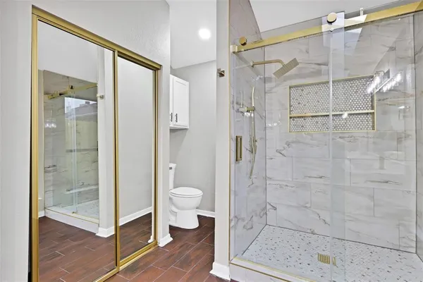 a bathroom with a toilet a sink and bathtub