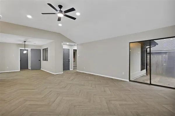 a view of an empty room with a window