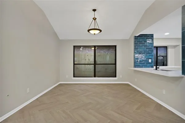 a view of a hallway with a chandelier