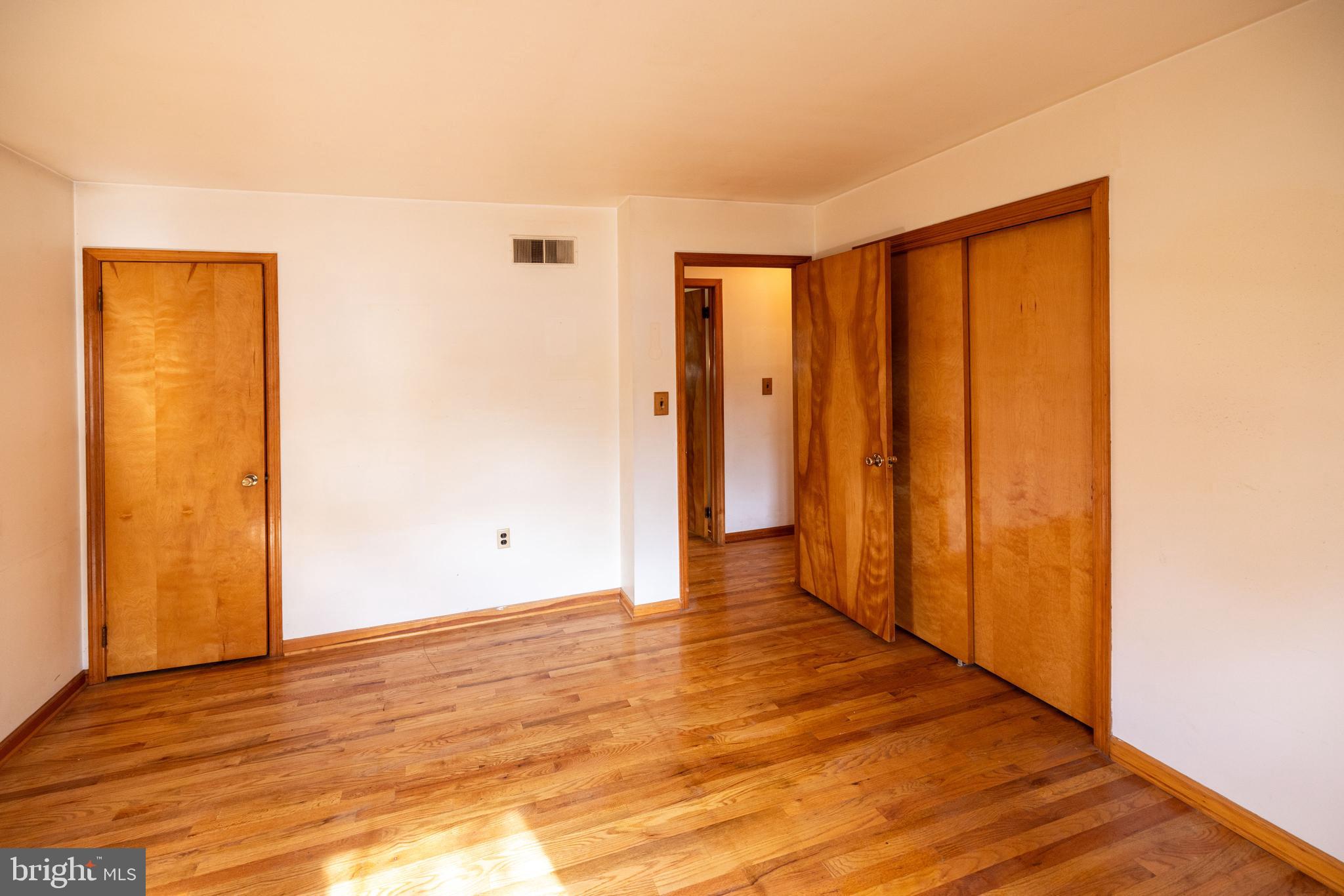 80 4th Avenue Hamilton, NJ 08619 - Photo 12 of 19 a view of an empty room with wooden floor