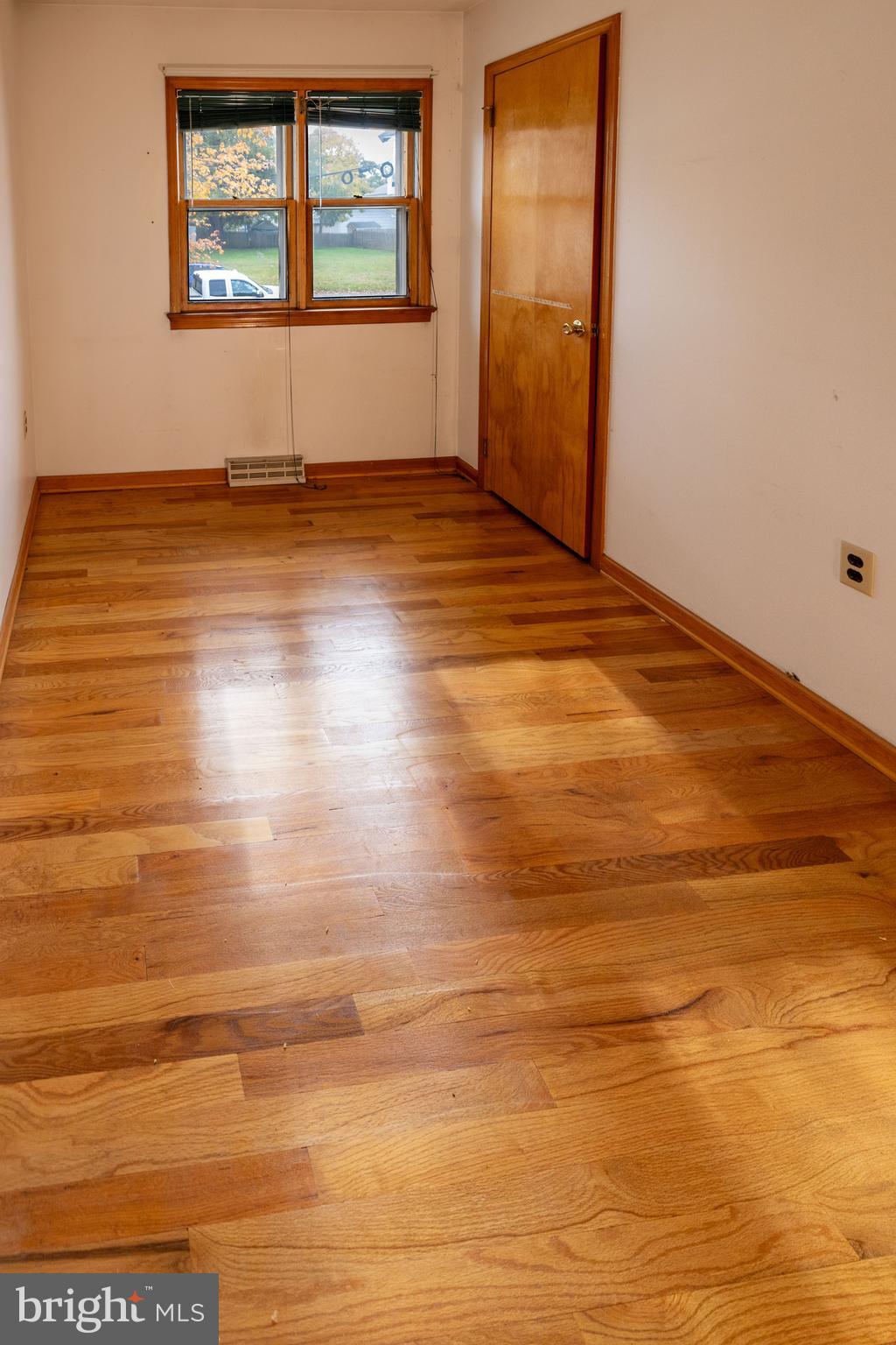 80 4th Avenue Hamilton, NJ 08619 - Photo 15 of 19 an empty room with wooden floor and windows
