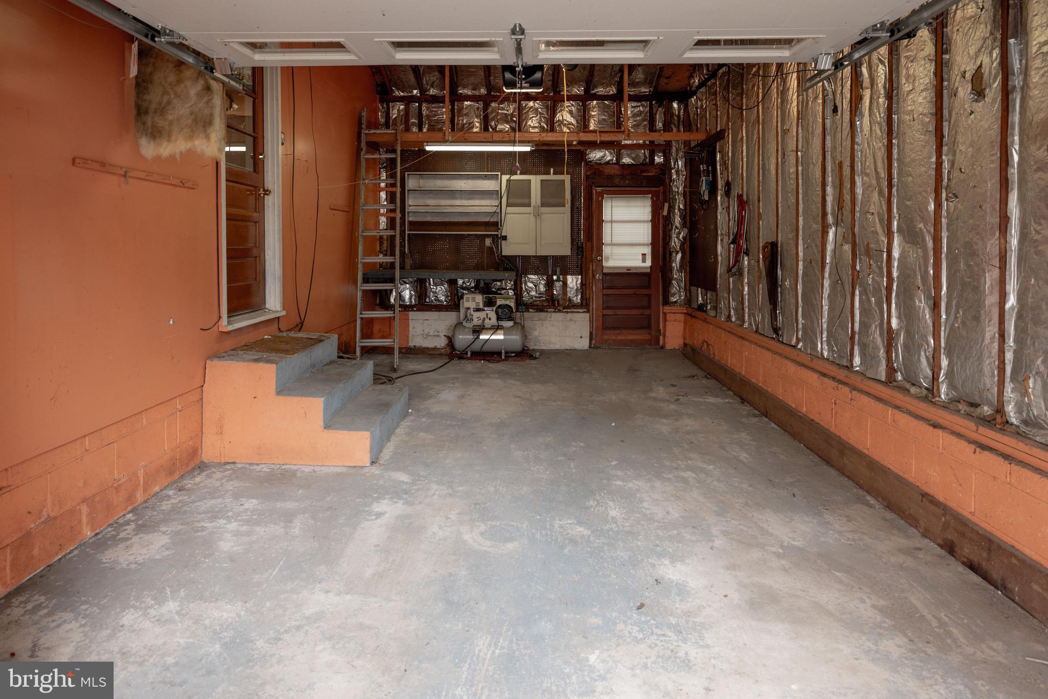 80 4th Avenue Hamilton, NJ 08619 - Photo 18 of 19 a view of water heater room with stairs