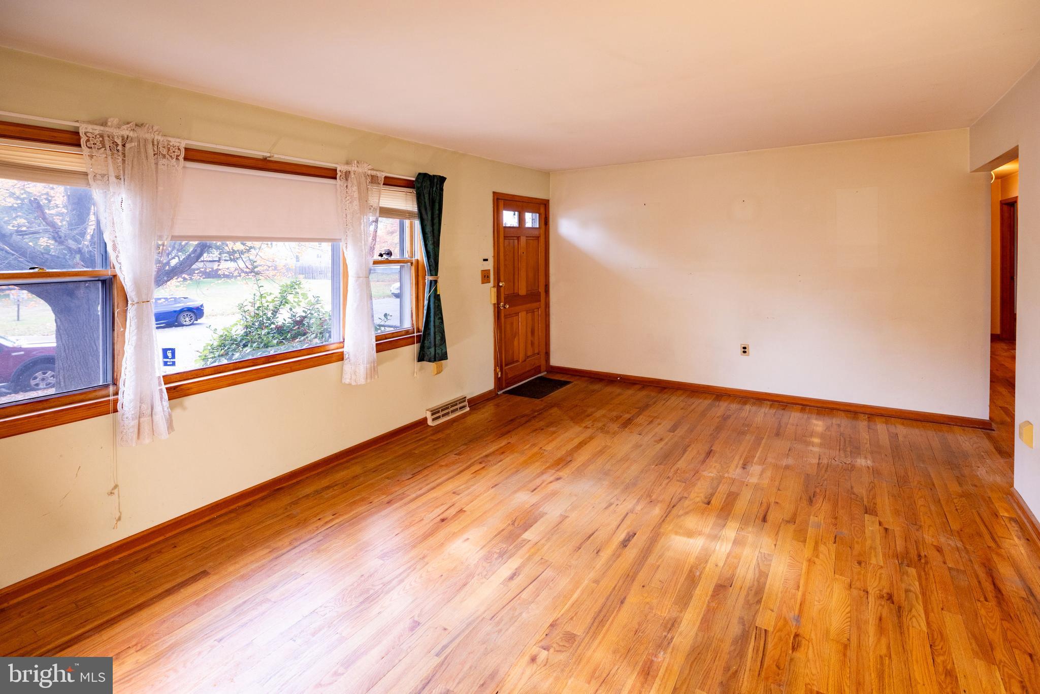 80 4th Avenue Hamilton, NJ 08619 - Photo 2 of 19 a view of a room with wooden floor and window