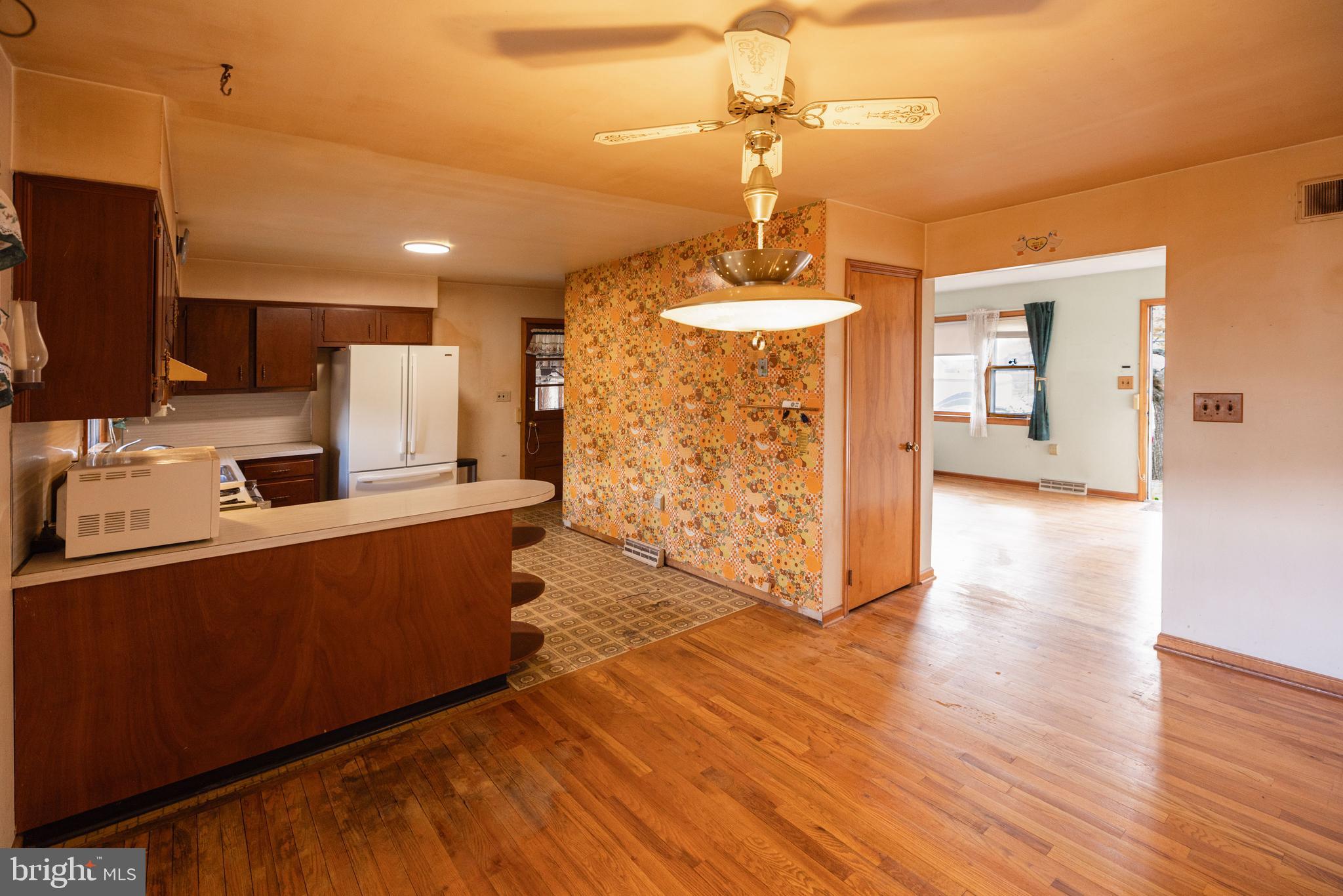 80 4th Avenue Hamilton, NJ 08619 - Photo 6 of 19 a kitchen with stainless steel appliances granite countertop a sink stove and wooden floor