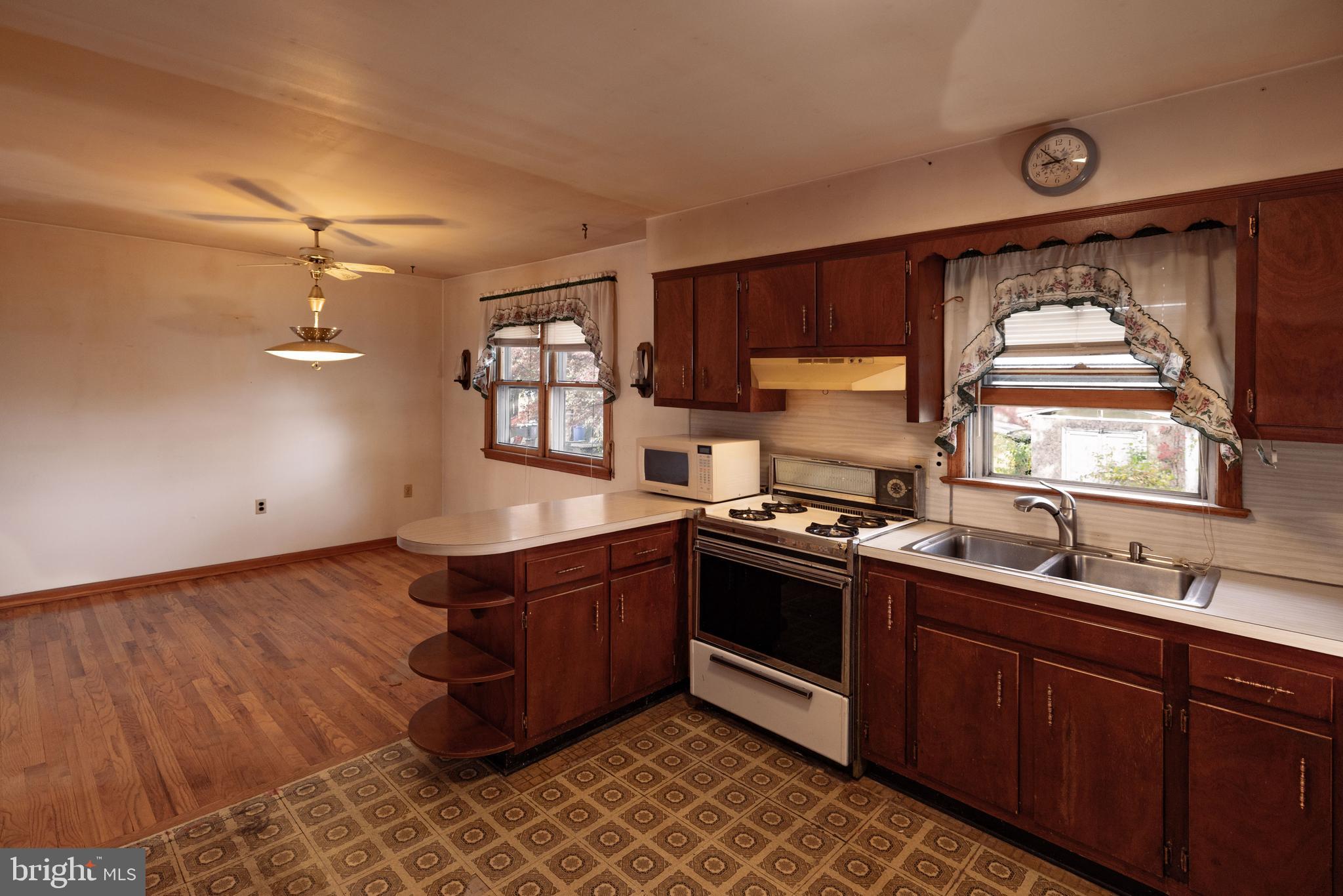 80 4th Avenue Hamilton, NJ 08619 - Photo 7 of 19 a kitchen with stainless steel appliances granite countertop a sink stove and cabinets