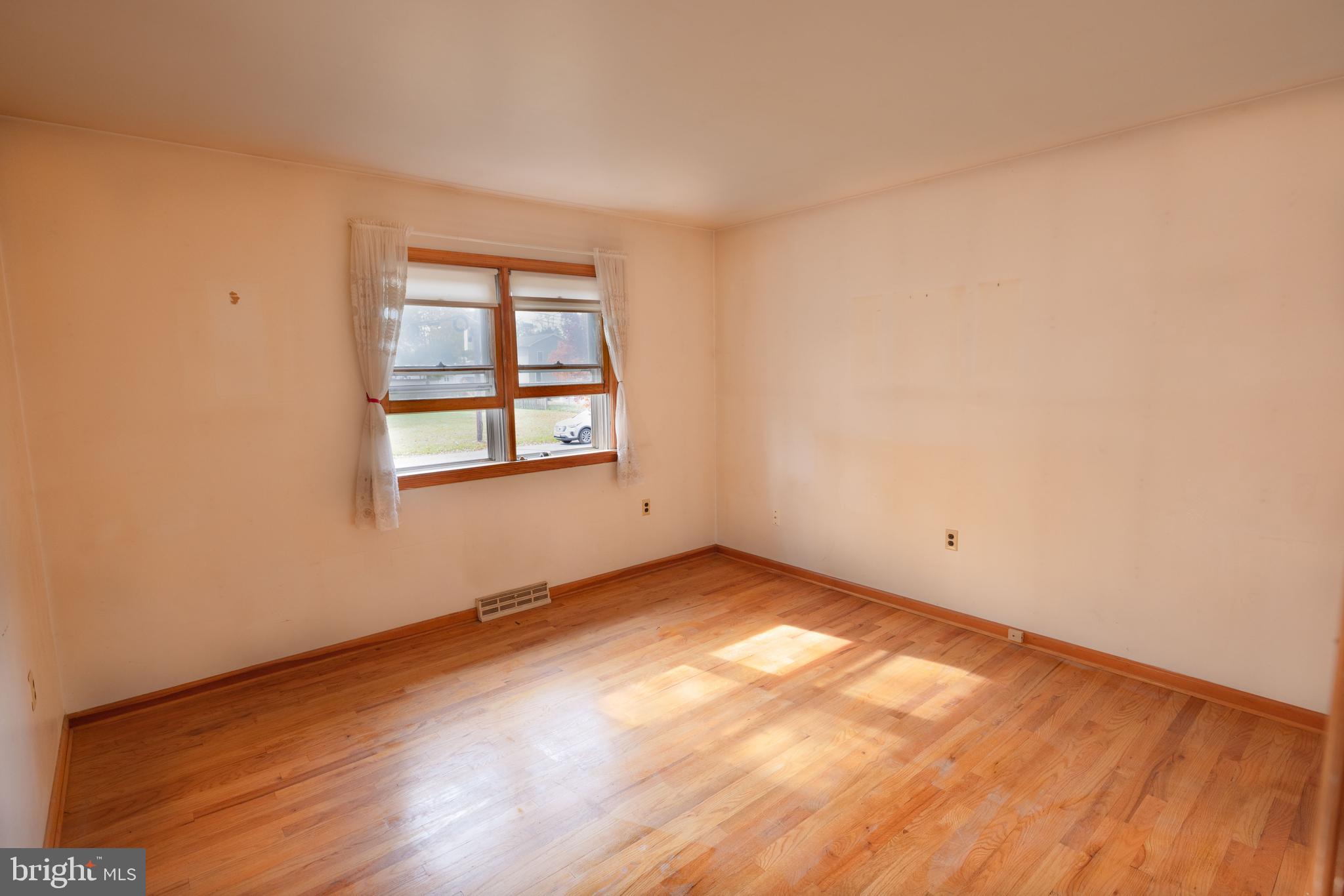 80 4th Avenue Hamilton, NJ 08619 - Photo 10 of 19 an empty room with wooden floor and windows