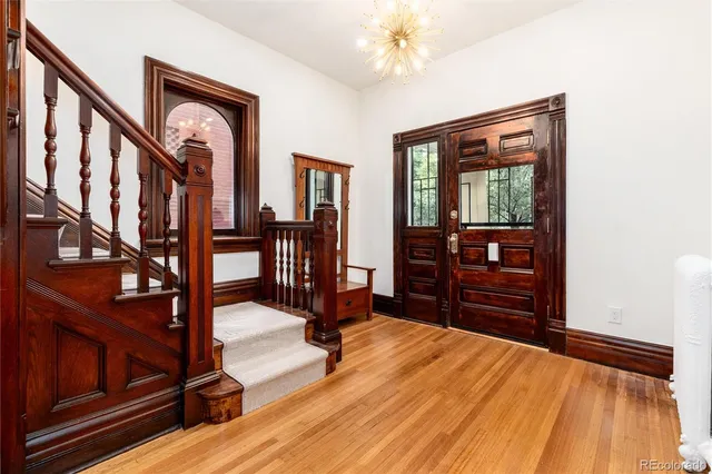 a bedroom with furniture and wooden floor