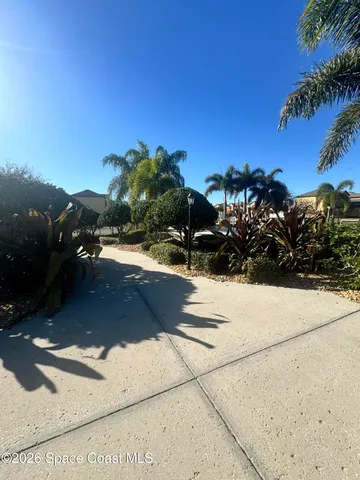 a view of a terrace with outdoor seating and water view