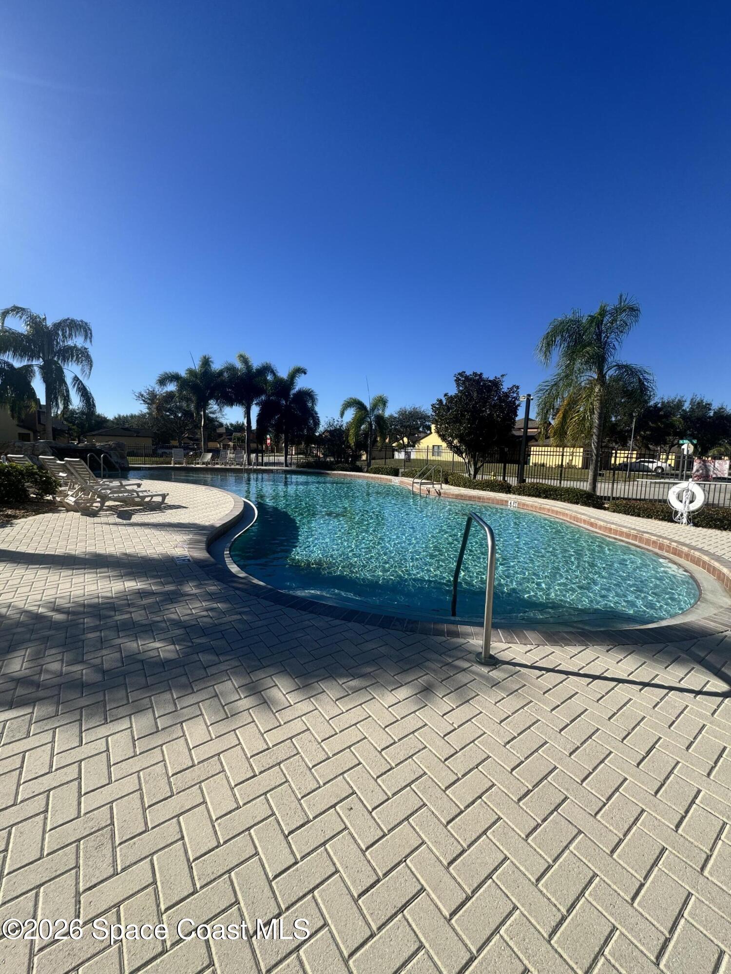 4575 Radiant Way, Unit 102 Melbourne, FL 32901 - Photo 12 of 73 a view of a pathway with a yard