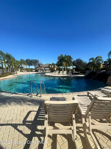 a room with furniture and a large window