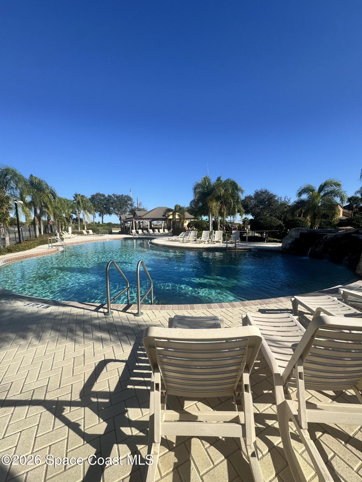 4575 Radiant Way, Unit 102 Melbourne, FL 32901 - Photo 17 of 73 a view of a terrace with outdoor seating and water view