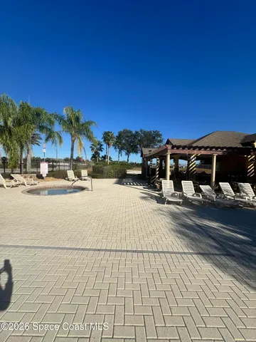 a view of a studio with wooden floor
