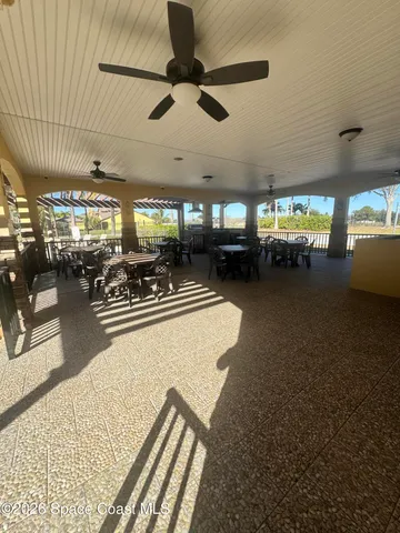 a view of kitchen with stainless steel appliances granite countertop sink and cabinets