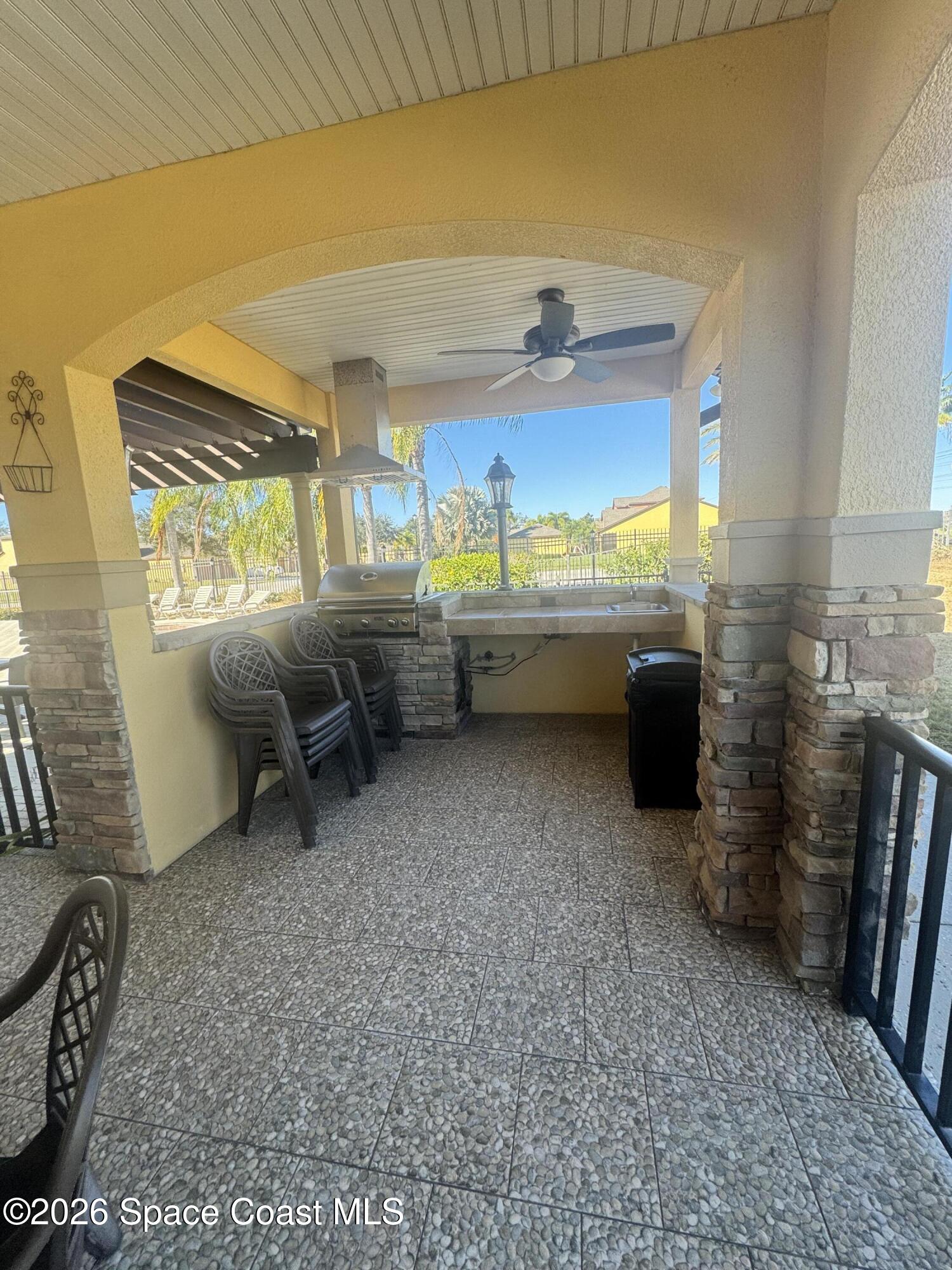 4575 Radiant Way, Unit 102 Melbourne, FL 32901 - Photo 29 of 73 a room with furniture and a large window