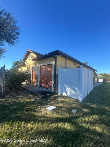 a view of kitchen with granite countertop sink and stove
