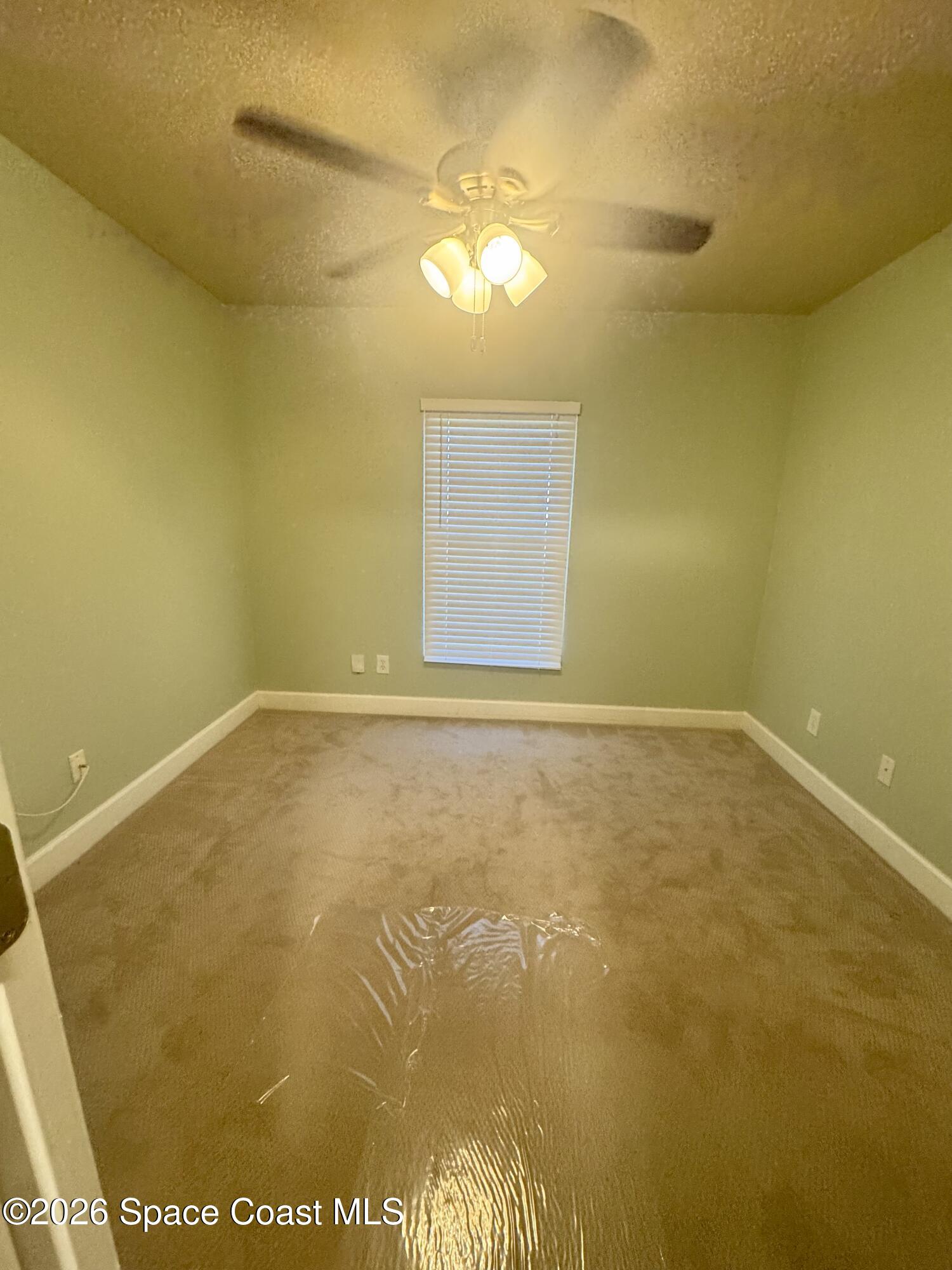 4575 Radiant Way, Unit 102 Melbourne, FL 32901 - Photo 53 of 73 a view of an empty room