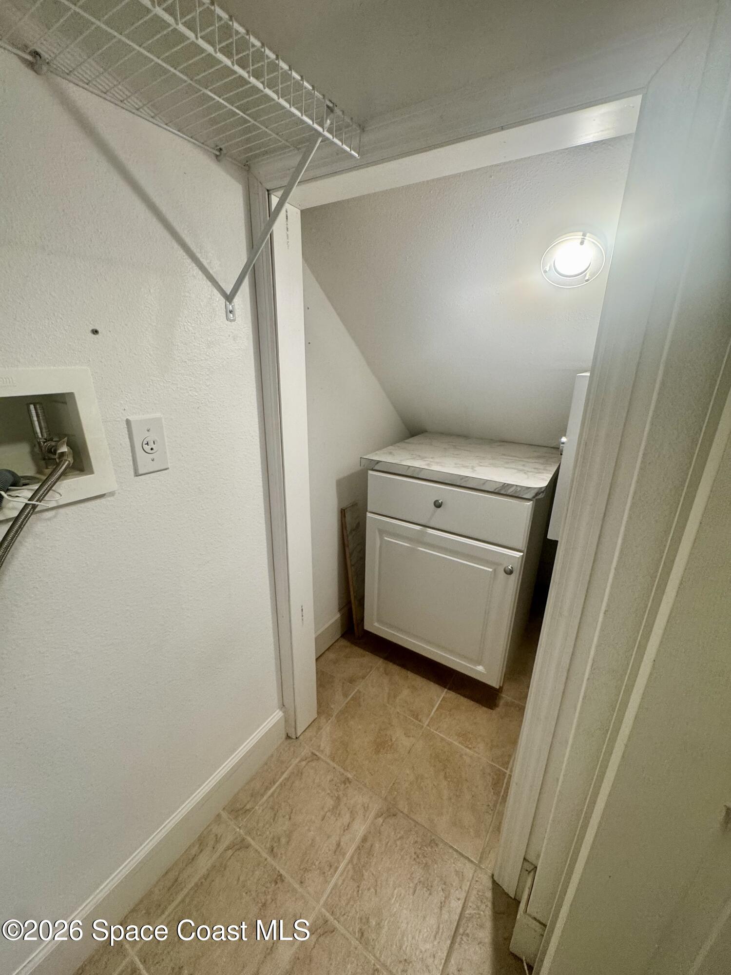 4575 Radiant Way, Unit 102 Melbourne, FL 32901 - Photo 54 of 73 a view of a storage & utility room with washer and dryer
