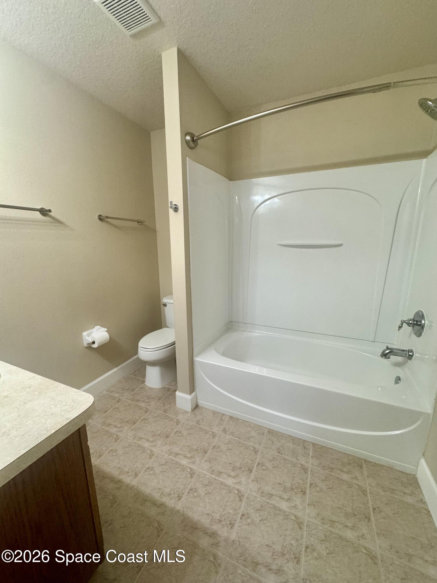 4575 Radiant Way, Unit 102 Melbourne, FL 32901 - Photo 64 of 73 a bathroom with a sink a toilet and a bathtub