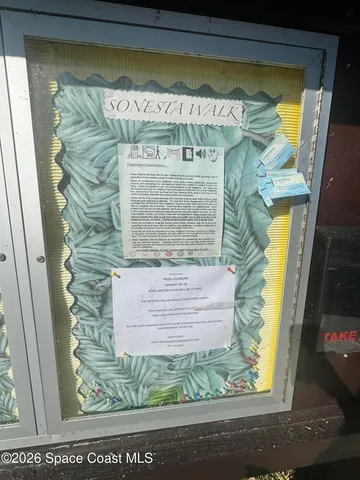 a view of a terrace with outdoor seating and city view